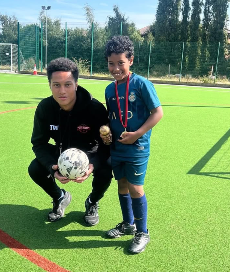 Player with medal on pitch